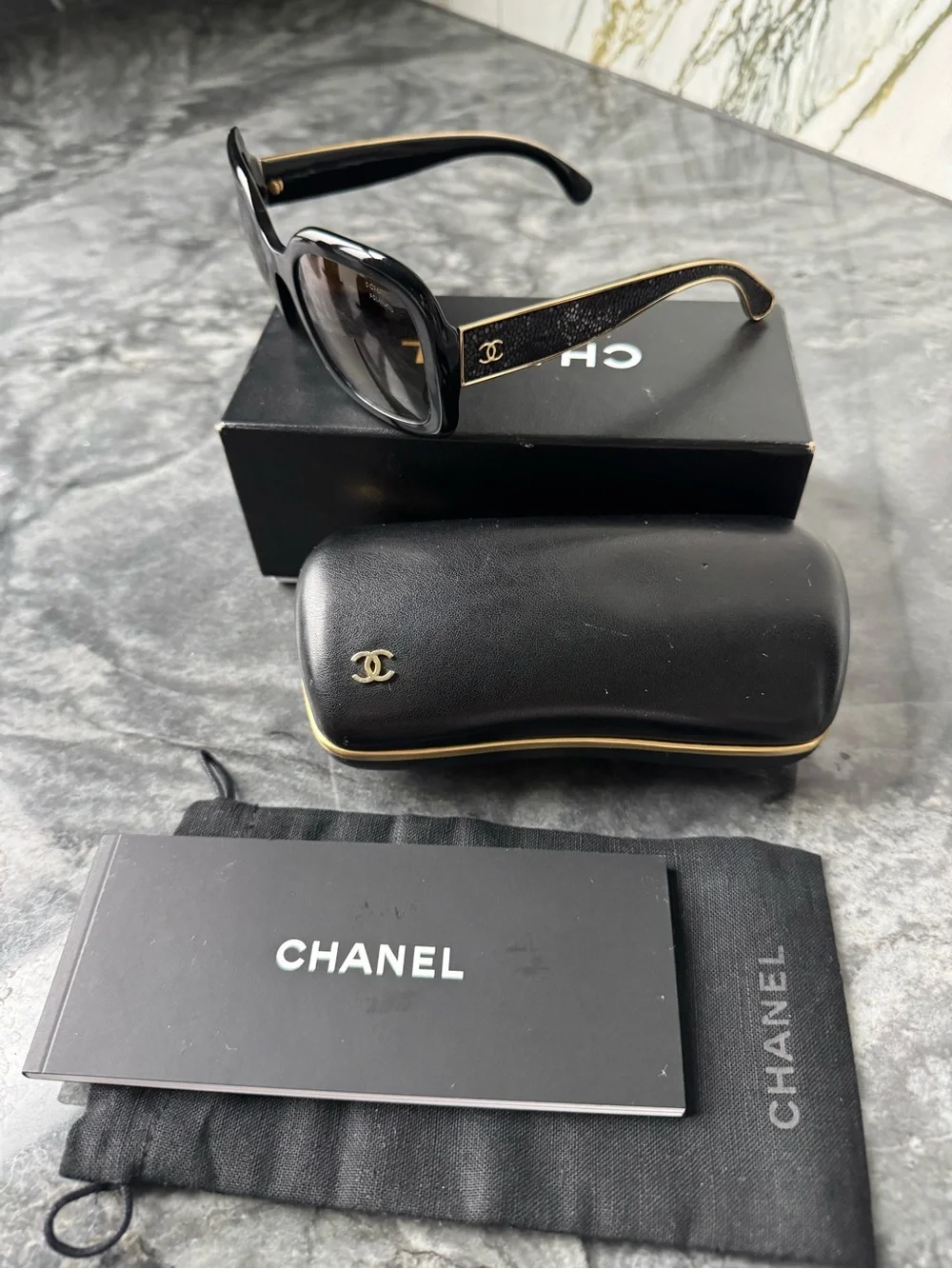 CHANEL Black Sunglasses with Gold Logo Accent